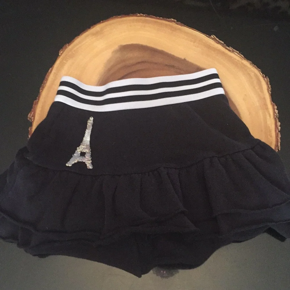 Justice skort black with white stripes on waist band size 6/7